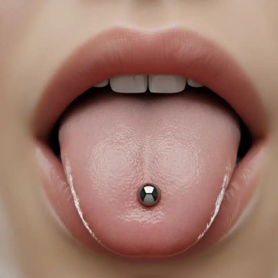 Piercing de lengua en Valencia: center y venom (pareados) con barras de titanio grado implante — BlackDrip Studio.